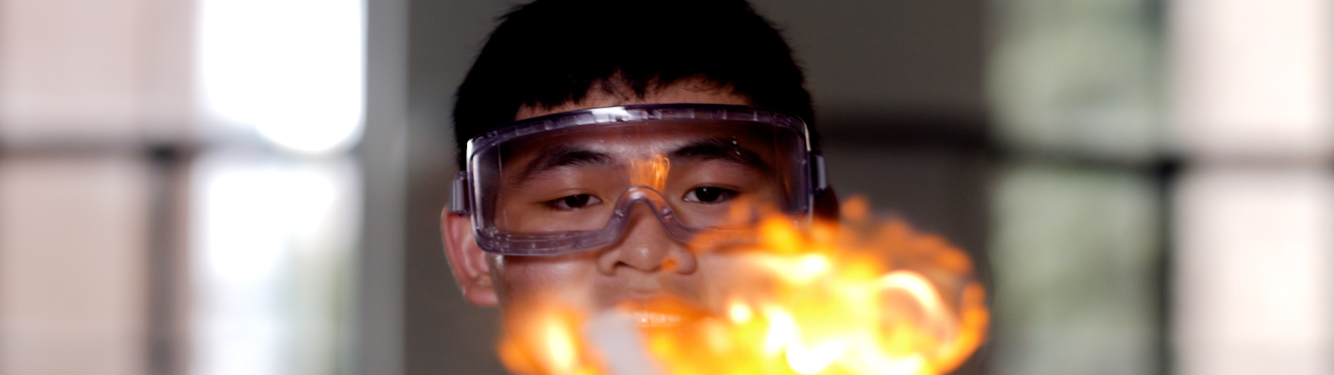 Chemistry student with PPE making explosion in lab