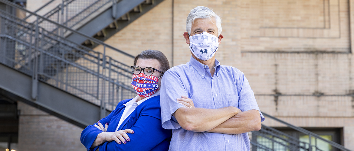 Randy Pepple and Cathy Allen wearing masks representing their political affiliations.